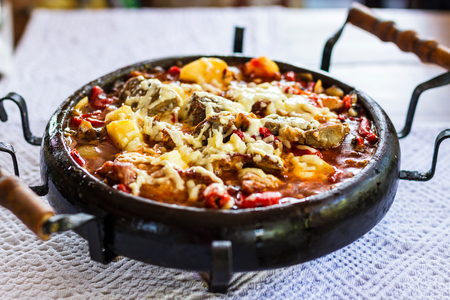 Meat with cheese on clay try. Bulgarian traditional cuisine sachの写真素材