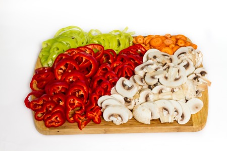 Fresh pepper carrot and mushrooms vegetables isolated on whiteの写真素材