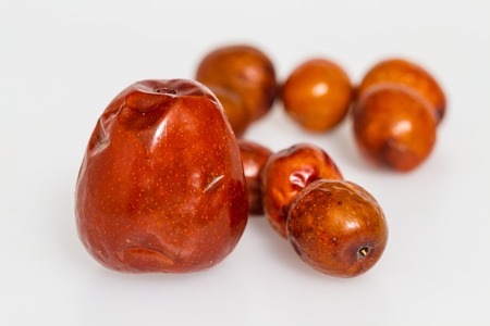 Chinese jujubes isolated on white background. Herbal food for heathy eating.の写真素材