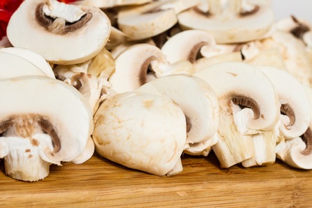 Sliced mushrooms texture prepared for cooking. Ready to be cooked.の写真素材