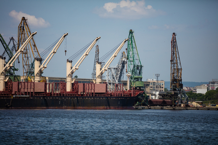 Working crane in shipyard at dusk for Logistic Import Export backgroundの写真素材