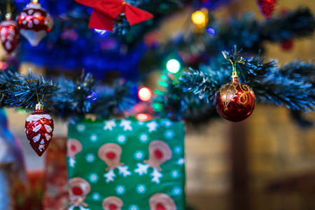 Decorated green christmas tree with lights and ballsの写真素材
