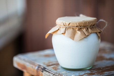 Fresh homemade yogurt in jars. Natural bio product from white milk for breakfast.の写真素材