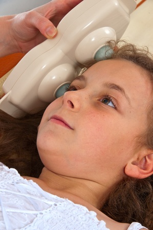 Giving medical therapy to girl.の写真素材