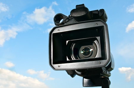 Professional Video Camera with sky in the backgroundの写真素材