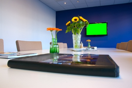 Conference table and chairs (green color on the TV can be replaced with your picture)のeditorial素材
