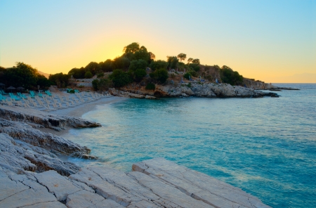 Small beach located in the bay at sunsetの写真素材