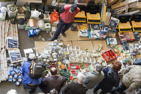 Barcelona, Spain - March 12, 2014  The most famous flea market in Barcelona, also known as Els Encants or Els Encants Vells, located in Glories neighborhood  Seller of electrical equipment in Second hand antiquities flea market in Barcelona, Spain   Els Eのeditorial素材