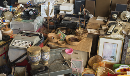 Barcelona, Spain - March 12, 2014  Objects used for sale in the most famous flea market in Barcelona, also known as Els Encants or Els Encants Vells, located in Glories neighborhood  Objects used for sale emphasizing an old Olivetti typewriter and percussのeditorial素材