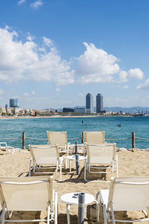 Beautiful summer morning on Barceloneta beach  The background looks a skyline of Barcelona の写真素材