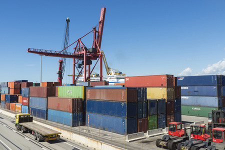 Barcelona, Spain - May 23, 2014   Container Terminal in the port of Barcelona  In the picture a...