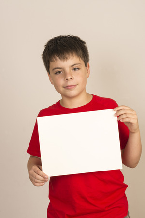 young boy holding blank sign の写真素材