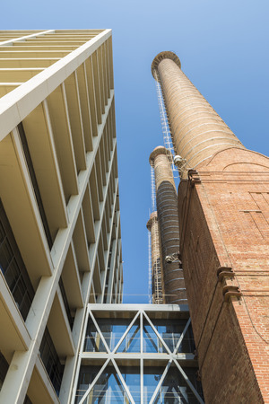 The three fireplaces located in the Parallel Avenue, symbol of the industrial past of the city of Barcelona, Catalonia, Spain.のeditorial素材