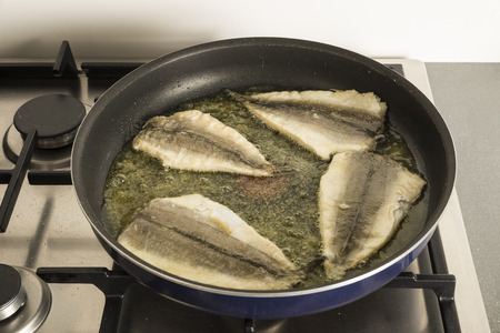 Fish frying in a panの写真素材