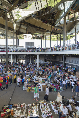 Barcelona, Spain - June 18, 2014  Overview of the most famous flea market in Barcelona, also known as Els Encants or Els Encants Vells, located in Glories neighborhood  It shows customers, vendors their jobs and their reflection in the ceiling mirror showのeditorial素材