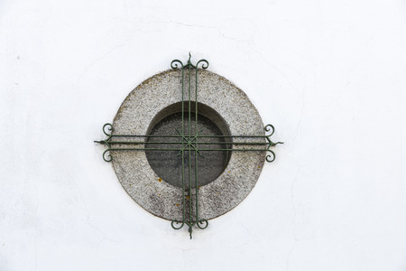 barred window in Evora, Portugal