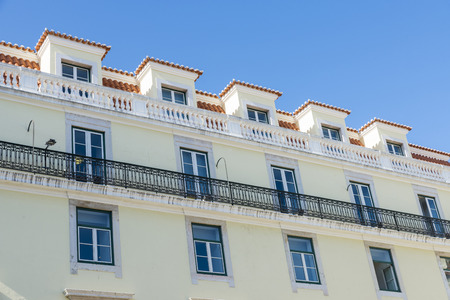 traditional building facade with characteristic balconies in Lisbon, Portugalの写真素材