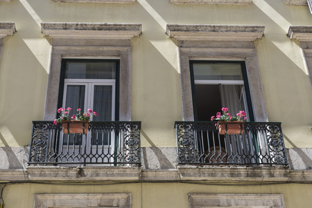traditional building facade with characteristic balconies in Lisbon, Portugalの写真素材