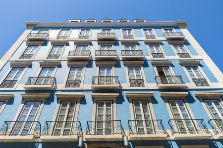traditional building facade with characteristic balconies in Lisbon, Portugalの写真素材