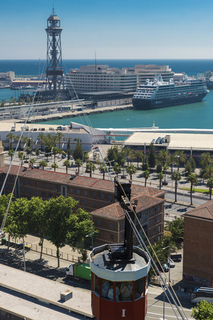 Barcelona, Spain - May 14, 2014: View of the cruise terminal from the mountain of Montjuic. First out of the cabin cable car full of tourists.のeditorial素材
