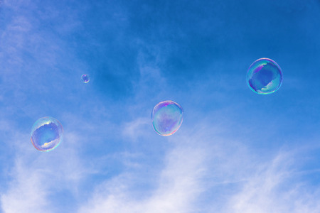 Transparent soap bubbles in the skyの写真素材