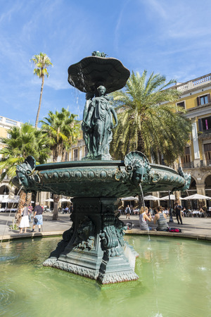 Barcelona, Spain - October 17, 2014: The famous Placa Reial into full swing with open terraces and tourists strollingのeditorial素材