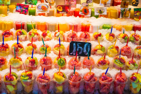 Barcelona, Spain - October 17, 2014: Fruit stand with chopped fruit and smoothies ready to take on the market of La Boqueria in Barcelona, ââCatalonia, Spainのeditorial素材