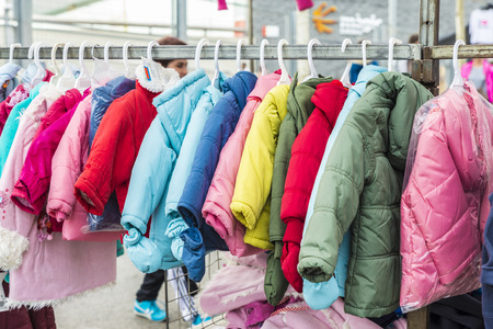 Badalona, Spain - November 1, 2014: Stall clothes in the market Turo Caritg in Badalona, a town next to Barcelona. The vendors serve customers while they choose and seek something you likeのeditorial素材