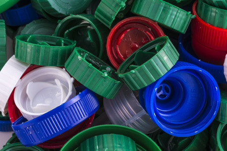 Closeup of a pile of plastic capsの写真素材