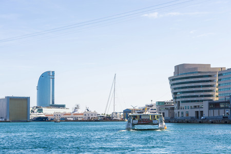 Barcelona, Spain - October 22, 2014: catamaran navigating on the Marina Port Vell in Barcelona Marina Port Vell is a main attraction in Barcelona. Barcelona is a vibrant modern city at the Mediterranean with lots of attractionsのeditorial素材