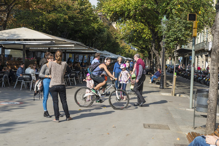 Barcelona, Spain - October 29, 2014: Rambla de Catalunya is one of the most central streets of the city. This walk is full of terraces where drinks. Tourists and citizens easy walk and talk on a nice dayのeditorial素材