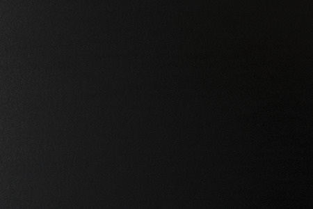 black textured background obtained from a metal surfaceの写真素材