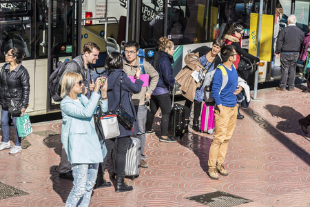 Barcelona, Spain - November 7, 2014: Group of newcomers tourists to Barcelona at a bus stopのeditorial素材