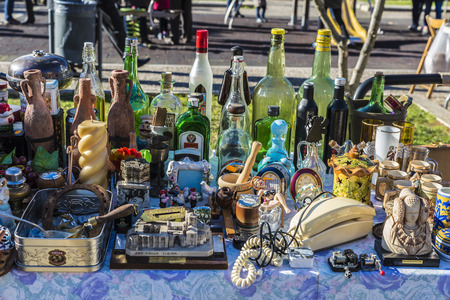Girona, Spain - December 28, 2014: Objects used, furniture, artwork and ornaments on a market stall in the flea market in Girona, also known as Mercat de la Lleonaのeditorial素材