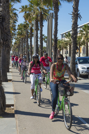 Barcelona, Spain - April 7, 2014: People cycling on the promenade to Barceloneta beachのeditorial素材