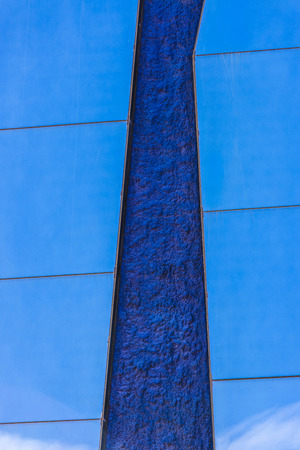 Sky reflected in the mirrors of a wallの写真素材