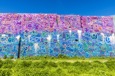 Barcelona, Spain - April 9, 2015: Wall covered with graffitis of pacifiers and puppetsのeditorial素材