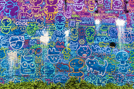 Barcelona, Spain - April 9, 2015: Wall covered with graffitis of pacifiers and puppetsのeditorial素材