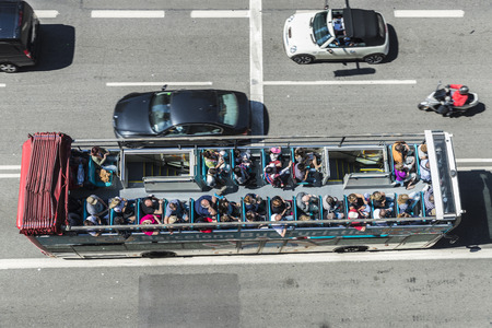 Barcelona, Spain - May 2, 2015: Aerial view of a tourist bus in motion. Barcelona City Tour is an official touristic bus service that shows the city with an audio guide.のeditorial素材