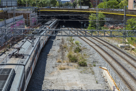 High view of a train entering a tunnel in Barcelona, Catalonia, Spainの写真素材