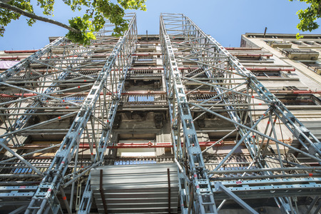 Construction of a building keeping the old facade through a system of beams in Barcelona, Catalonia, Spain.の写真素材