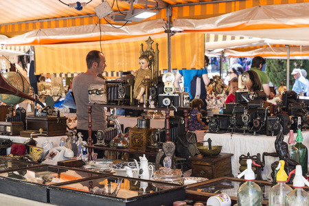 Barcelona, Spain - June 17, 2015: Flea market located in front of Barcelona Cathedral. In the picture you see a seller and customers in a place where they predominate the old camerasのeditorial素材