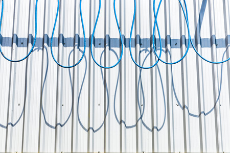 Hose hung snakelike in a car washの写真素材
