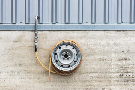 Coiled hose in a car washの写真素材
