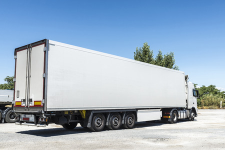 White truck equipped with refrigeration goods parked at a gas station in Spainの写真素材
