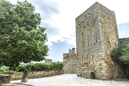Medieval street with a tower defense in Pals, Girona, Catalonia, Spainのeditorial素材