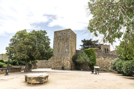 Medieval street with a tower defense in Pals, Girona, Catalonia, Spainのeditorial素材