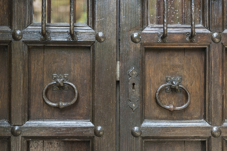 Old barred door in Pals, Girona, Catalonia, Spain