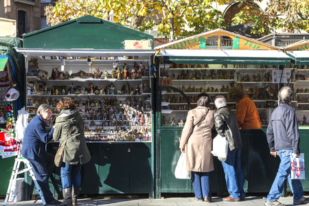 Barcelona, Spain - December 19, 2014: Santa Llucia Fair is a Christmas market. The most important figure is the birth of baby Jesus, caganer and caga tioのeditorial素材
