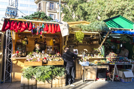 Barcelona, Spain - December 19, 2014: Santa Llucia Fair is a Christmas market. The most important figure is the birth of baby Jesus, caganer and caga tioのeditorial素材